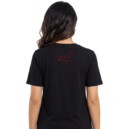 Person wearing a black t-shirt with red text on the back, standing against a white background