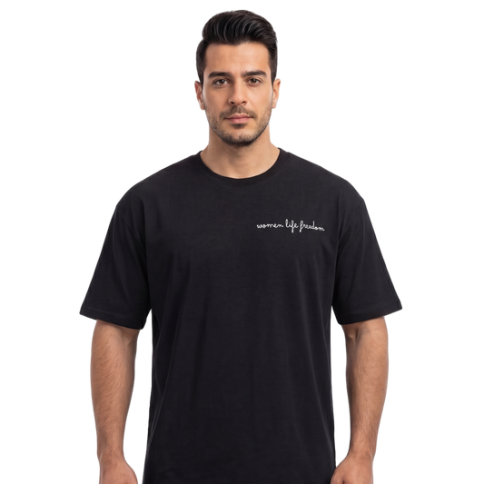 Man wearing a black t-shirt with text on a white background