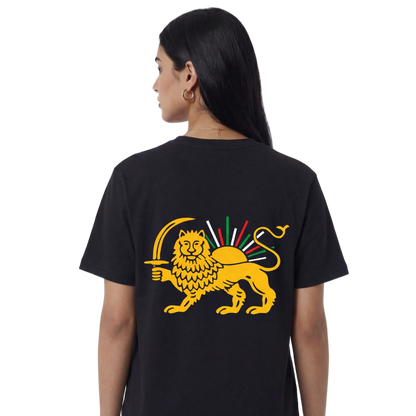 Person wearing a black t-shirt with a yellow lion design on the back, on a white background
