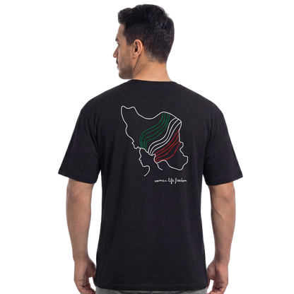 Man wearing a black t-shirt with a colorful design on the back, standing against a white background.